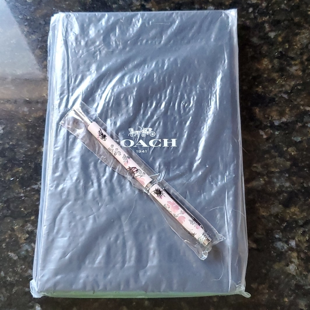 Coach notebook and pen